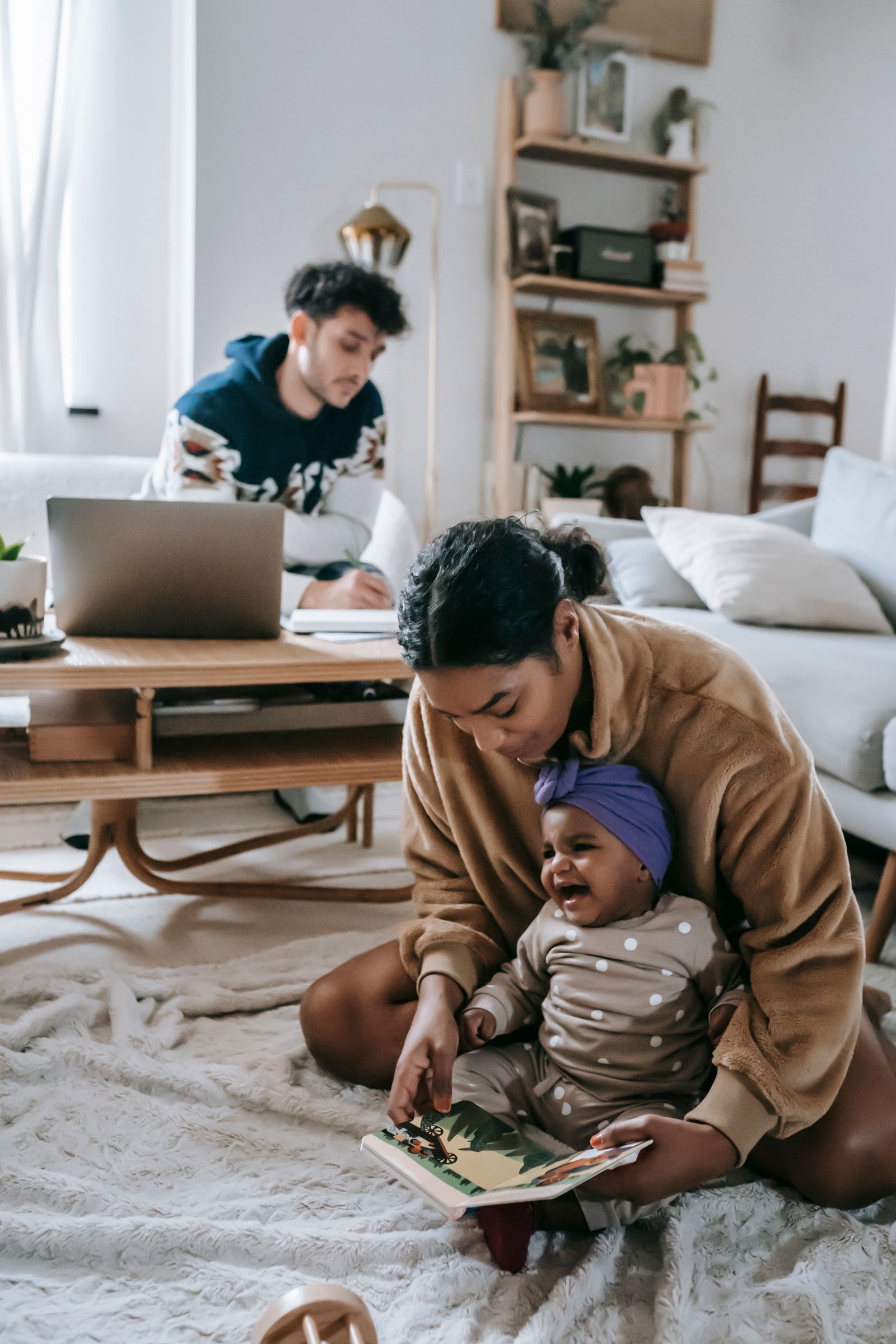 Family at home welcoming their newborn in Utah County